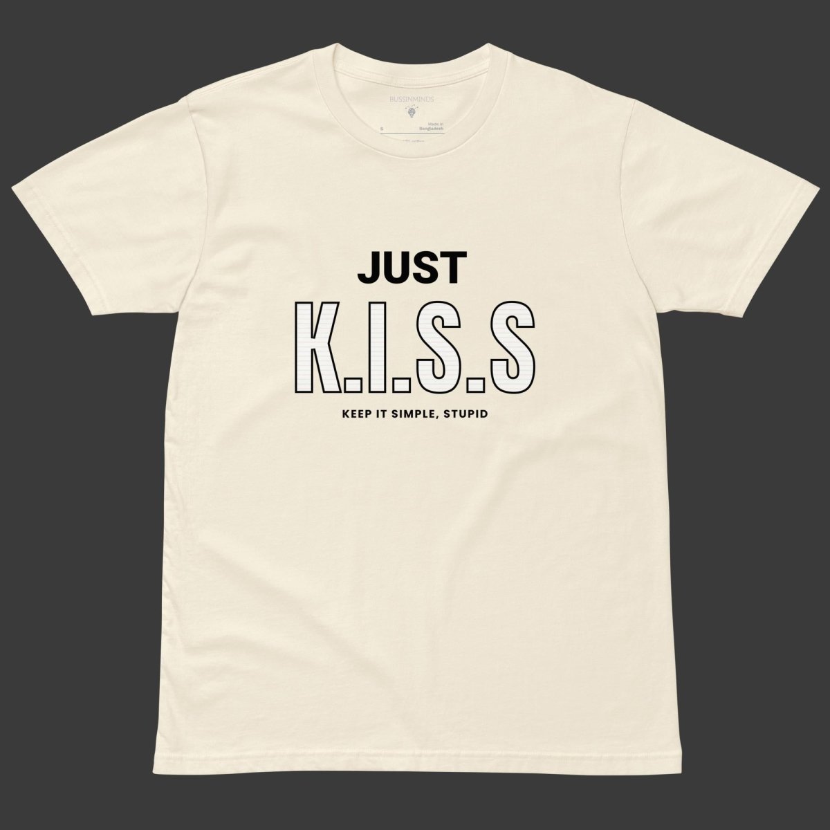 Beige t-shirt with bold black text “JUST K.I.S.S” and smaller text “Keep It Simple, Stupid” centered on the front.