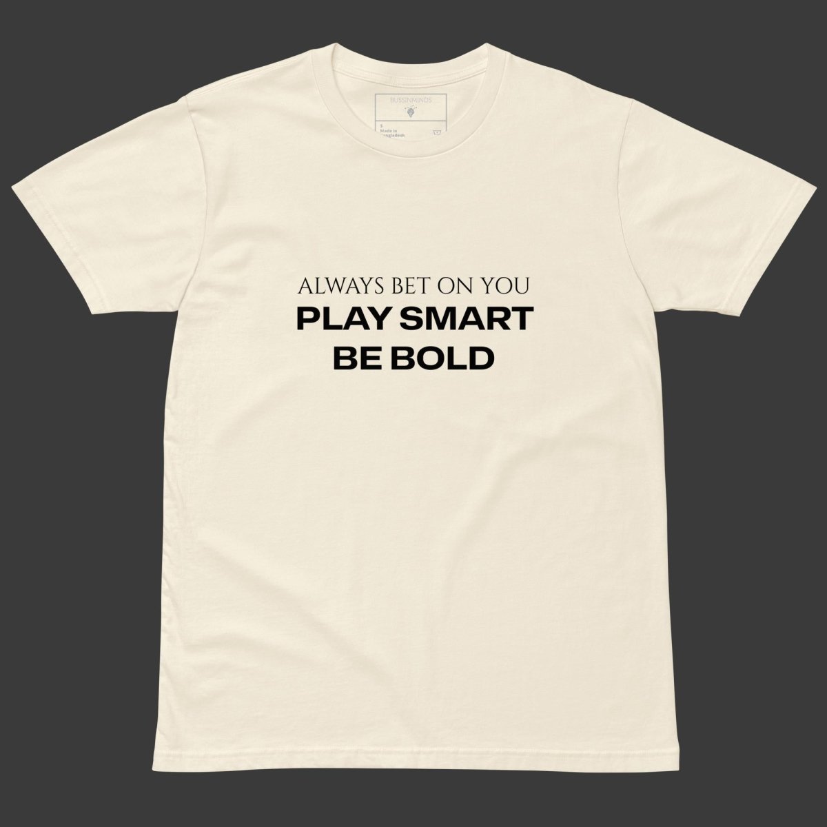 Beige t-shirt with bold black text “Always Bet On You – Play Smart Be Bold,” designed for confident, ambitious creators.