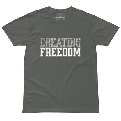 Charcoal Green tee with bold gray and white text “Creating Freedom” and small “Brick by Brick” centered below
