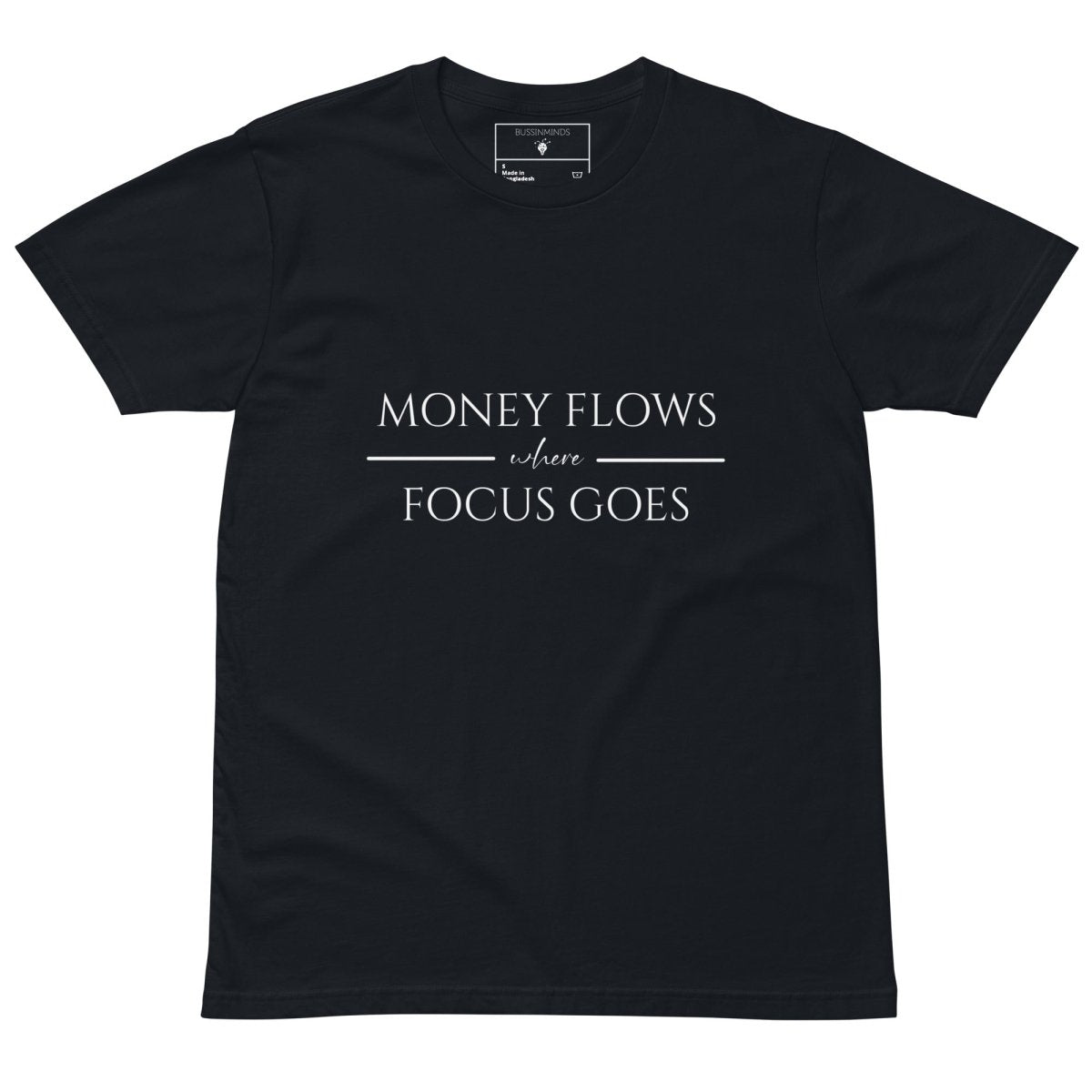Navy tee with white text “Money Flows Where Focus Goes” in elegant serif font, with horizontal lines next to “where"